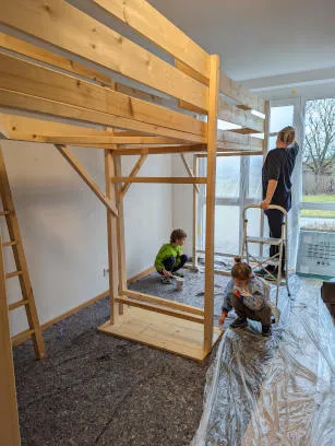 Family painting wooden beds